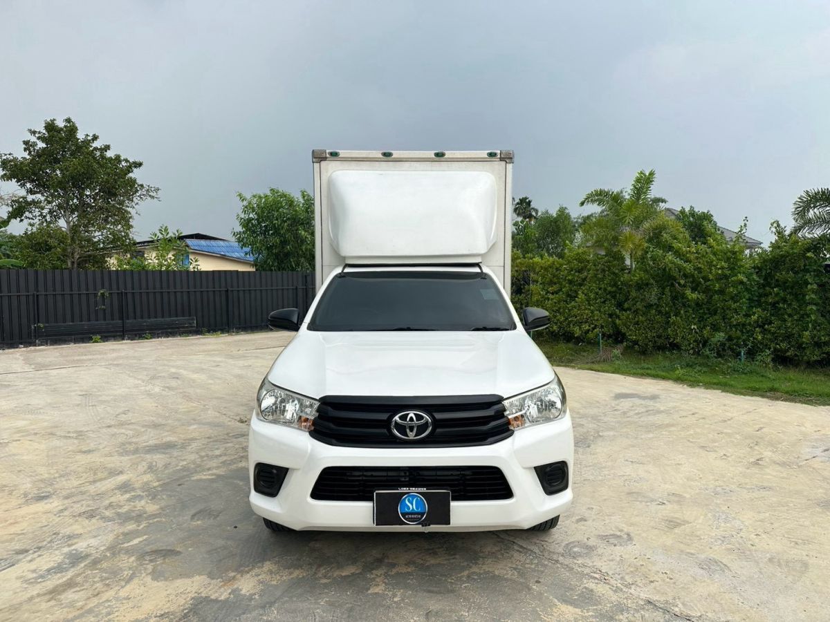 Front view of Toyota Hilux Revo Single Cab 2.4 J year 2016 white color used car with dry box in Hatyai